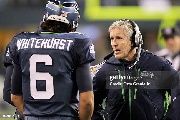 Head coach Pete Carroll of the Seattle Seahawks talks with quarterback Charlie Whitehurst during their game against the St. Louis Rams at Qwest Field...