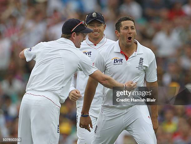 Tim Bresnan of England celebrates the wicket of Shane Watson of Australia with team mates during day one of the Fifth Ashes Test match between...