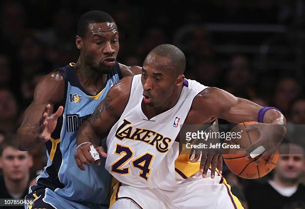 Kobe Bryant of the Los Angeles Lakers is defended by Tony Allen of the Memphis Grizzlies during the first half at Staples Center on January 2, 2011...