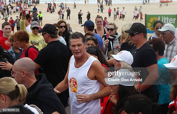 Star of Baywatch David Hasselhoff patrols the beach to promote the new "Splice Real Fruit" ice block at Bondi Beach on January 3, 2011 in Sydney,...