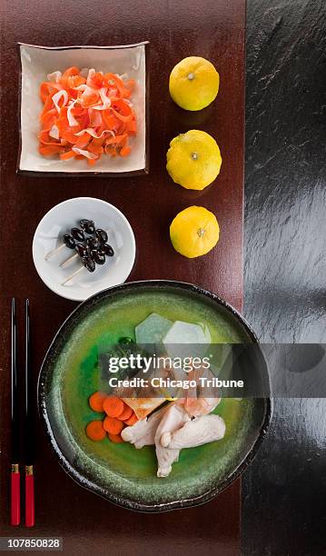 Kohaku Namasu, top, Kuro mame , center, and Ozoni soup are some of the Japanese recipes that can be made at home.