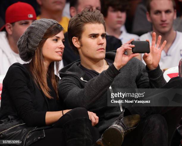 Torrey DeVitto and Paul Wesley attend a game between the Memphis Grizzlies and the Los Angeles Lakers at Staples Center on January 2, 2011 in Los...