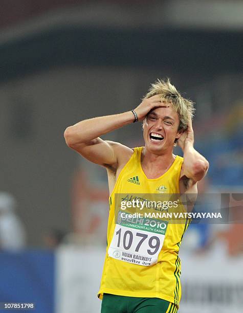 Australia's Simon Patmore celebrates winning gold in the parasport men 100m final of the Track and Field competition of the XIX Commonwealth games on...