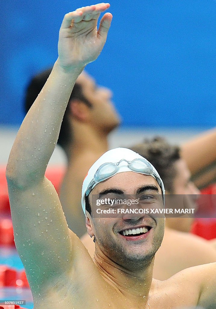Tongan swimmer Amini Fonua gestures duri