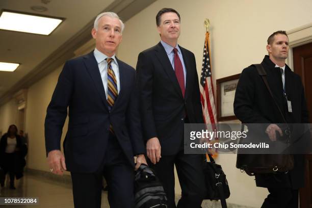 Former Federal Bureau of Investigation Director James Comey arrives at the Rayburn House Office Building before testifying to the House Judiciary and...
