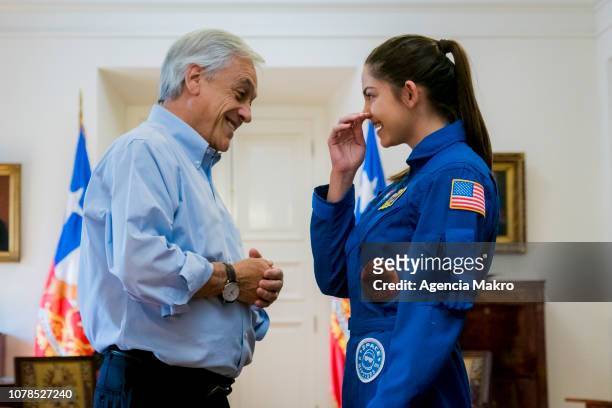 President of Chile Sebastián Piñera laughs with Alyssa Carson , an aspiring astronaut who is preparing for an eventual manned mission to Mars, during...