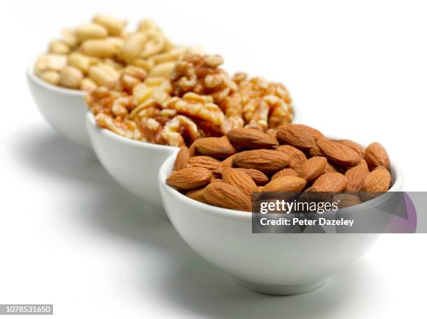 bowls of nuts / nut allergy - 核桃 個照片及圖片檔