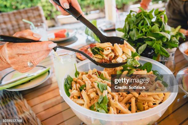 serving pasta salad - pasta salad stock pictures, royalty-free photos & images