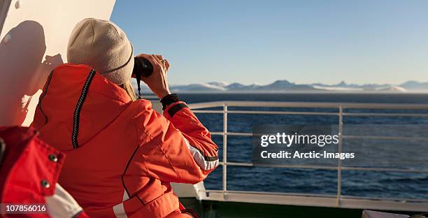 woman with binoculars, cruise ship - découverte photos et images de collection