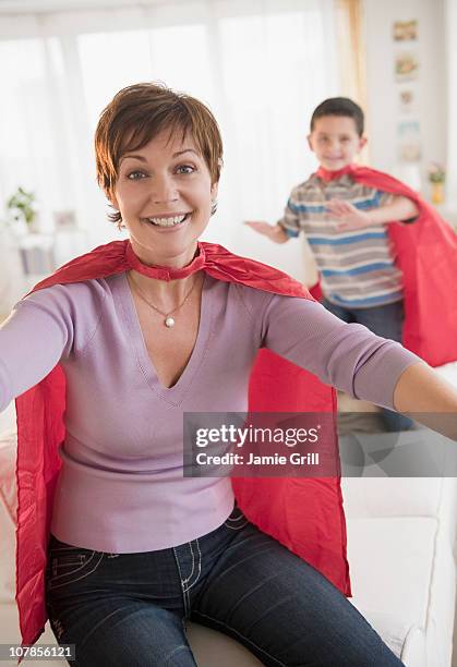 mother and son wearing superhero capes - supermom ストックフォトと画像