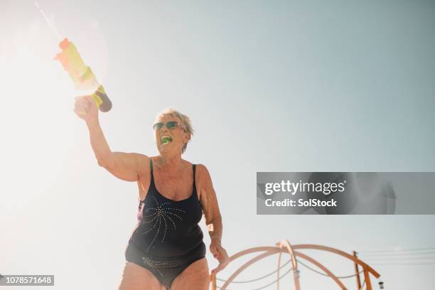 age is just a number - old woman in swimsuit stock pictures, royalty-free photos & images