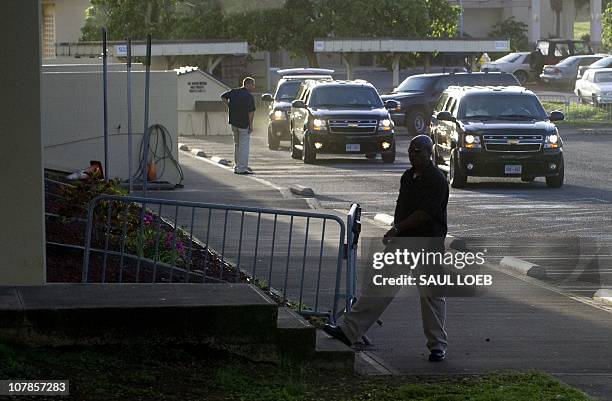 President Barack Obama's motorcade arrives at Semper Fit at the Marine Corps Base Hawaii at Kaneohe Bay, Hawaii, January 3 as Obama holds a morning...