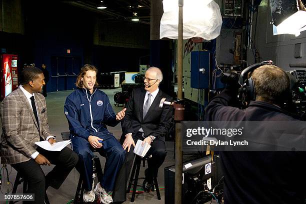 Tom Gilbert of the Edmonton Oilers is interviewed by Scott Oake and Kevin Weekes for Hockey Night in Canada's "After Hours" at Rexall Place on...