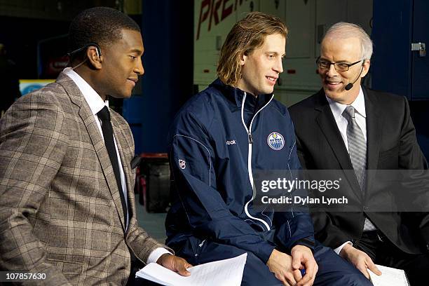 Tom Gilbert of the Edmonton Oilers is interviewed by Scott Oake and Kevin Weekes for Hockey Night in Canada's "After Hours" at Rexall Place on...