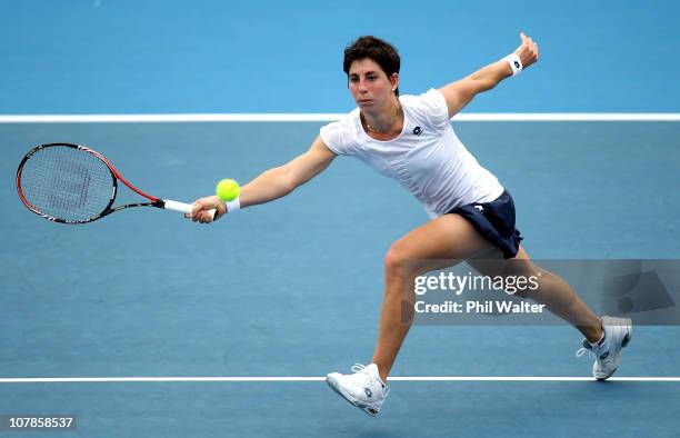 Carla Suarez Navarro of Spain plays a forehand during her match against Romina Oprandi of Italy during day one of the ASB Classic at ASB Tennis...