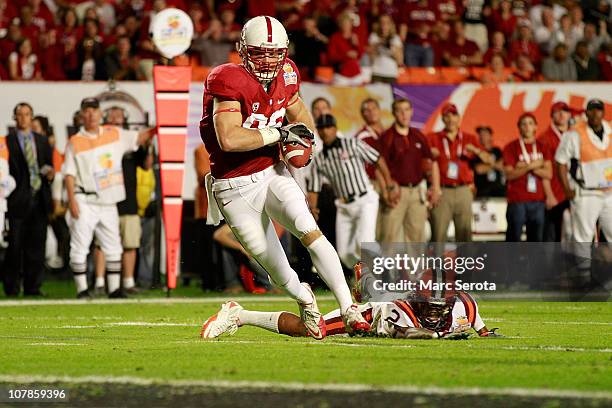 Zach Ertz of the Stanford Cardinal scores a 25-yard touchdown reception in the second quarter against the Virginia Tech Hokies during the 2011...