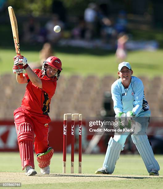 Karen Rolton of the Scorpions bats in front of Claire Koski of the Breakers during the Women's Twenty20 match between the South Australian Scorpions...