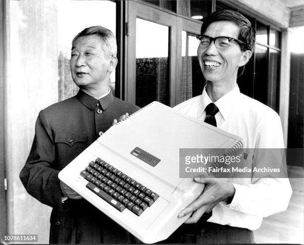 Mr Cui Gengsheng Consul General of the People's Republic of China in Sydney, and Mr Da Xiao Yi with the computer.A scientist from the People's...