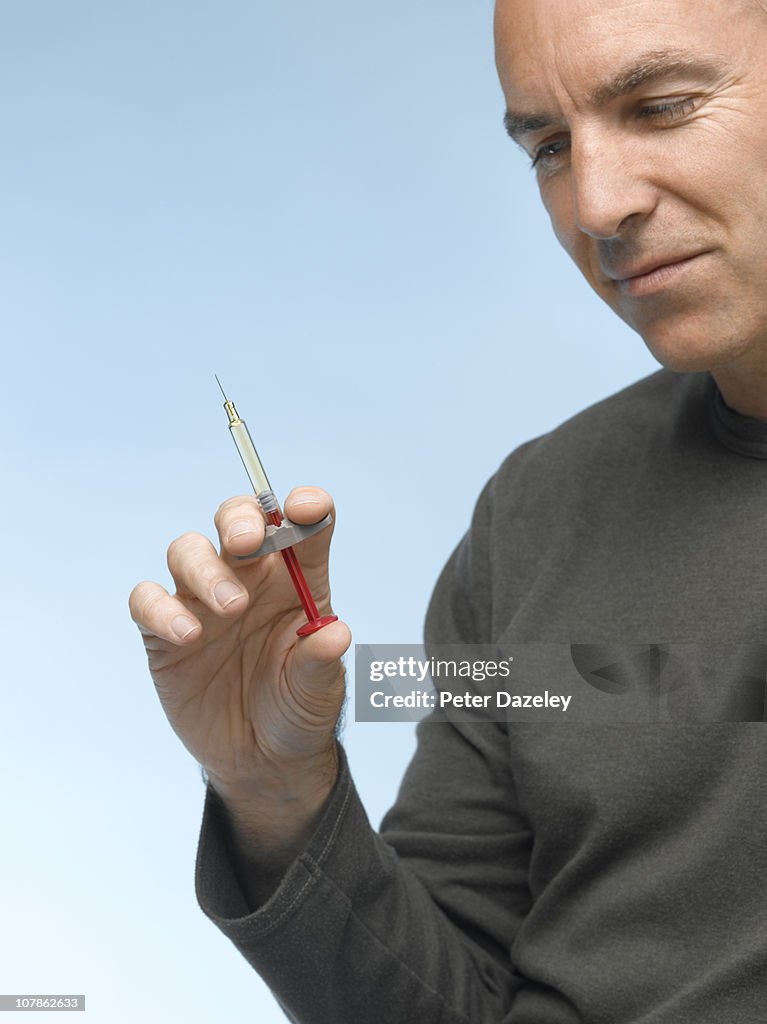 Man with diabetes syringe