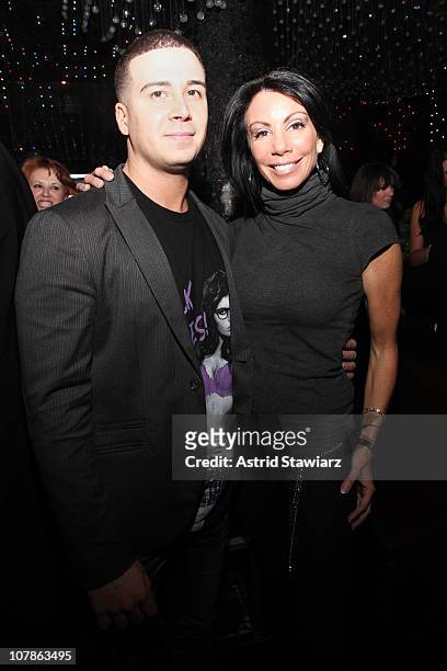 Personality from "Jersey Shore" Vinny Guadagnino greets Danielle Staub during his IHAV clothing line launch party at Greenhouse on January 3, 2011 in...