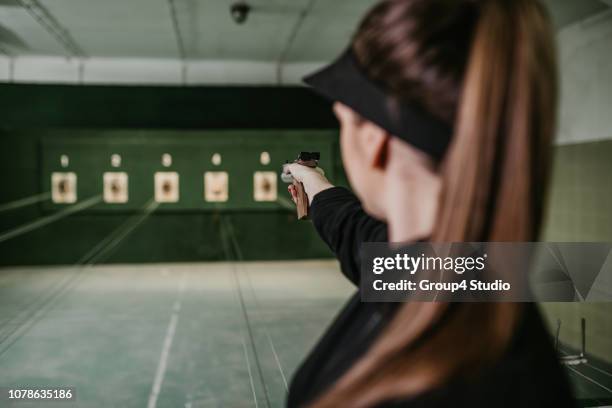 shooting range - indoor gun range stock pictures, royalty-free photos & images