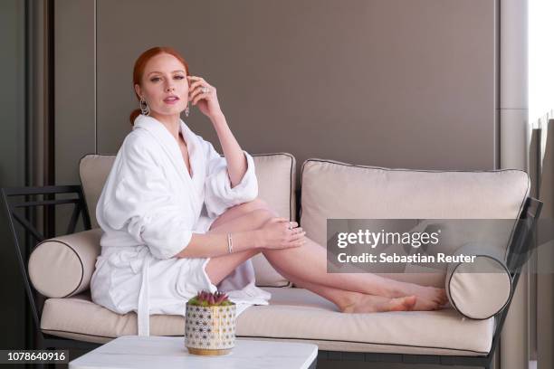 German model and actress Barbara Meier poses on the balcony of her hotel suite ahead of the 76th annual Golden Globe Awards at Waldorf Astoria...