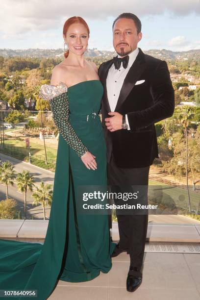 Barbara Meier and her fiance Klemens Hallmann pose on the balcony of her hotel suite ahead of the 76th annual Golden Globe Awards at Waldorf Astoria...