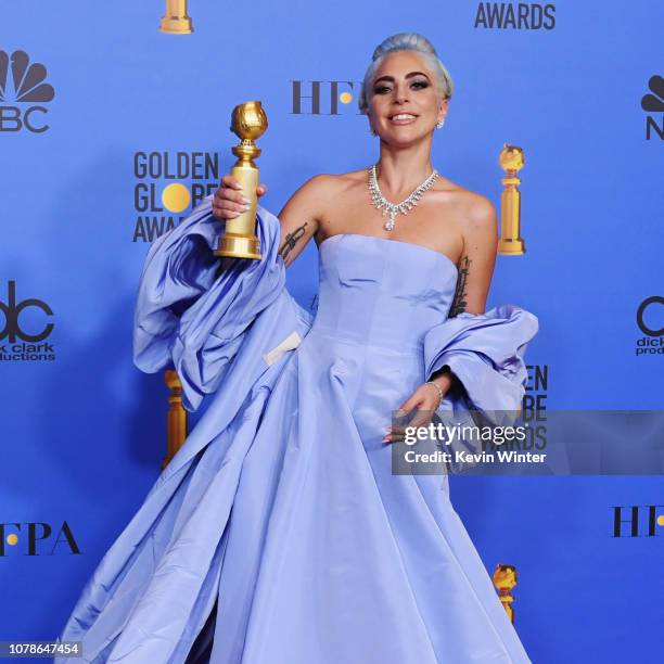 Winner for Best Original Song - Motion Picture for 'Shallow - A Star is Born' Lady Gaga poses with the trophy in the press room during the 76th...