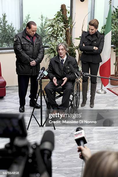 Italian Prime Minister Silvio Berlusconi and Italian politician Daniela Santanche face media alongside Alberto Torregiani, the son Pierluigi...