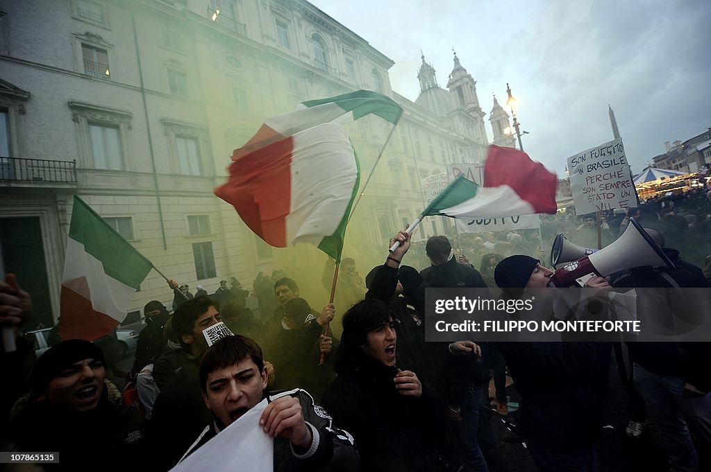 Demonstrators wave Italian flags in fron