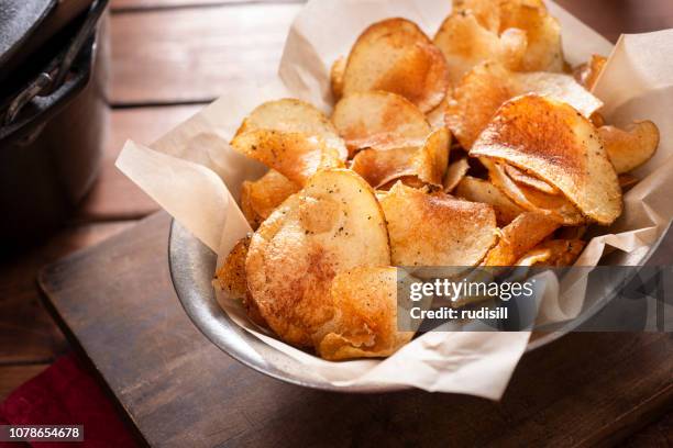 homemade potato chips - prepared potato stock pictures, royalty-free photos & images