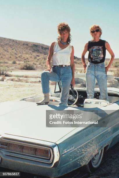 Actresses Susan Sarandon and Geena Davis pose on their 1966 Ford Thunderbird, for the film 'Thelma And Louise', 1991.