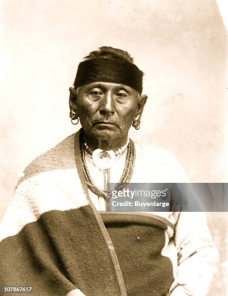 Bear Legs, an Osage Indian, half-length portrait, seated, facing front, 1906.