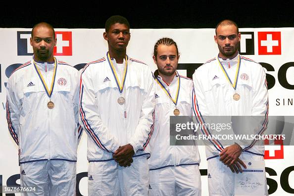 Philippe Riboud French team poses on the podium after winning the bronze medal of the ...