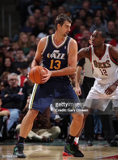 Mehmet Okur of the Utah Jazz handles the ball during a game against the Milwaukee Bucks on December 18, 2010 at the Bradley Center in Milwaukee,...