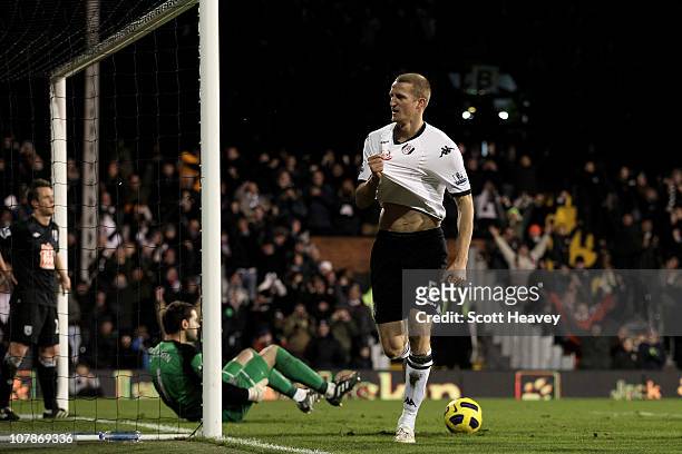 Brede Hangeland of Fulham celebrates after scoring their third goal during the Barclays Premier League match between Fulham and West Bromwich Albion...