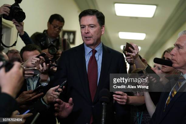 Former Federal Bureau of Investigation Director James Comey speaks to members of the media at the Rayburn House Office Building after testifying to...