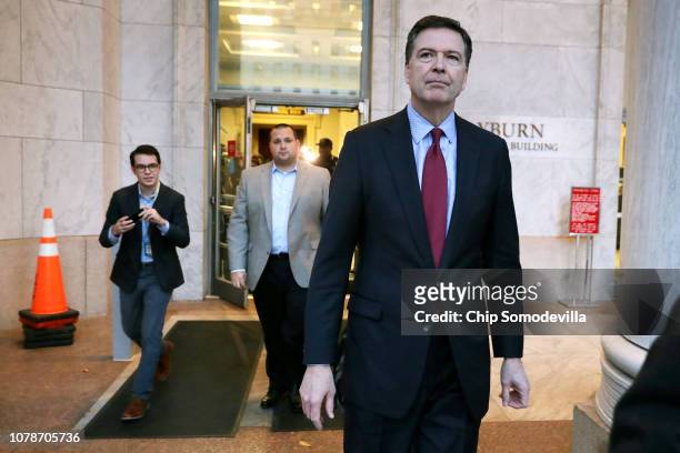 Former Federal Bureau of Investigation Director James Comey leaves the Rayburn House Office Building after testifying to the House Judiciary and...