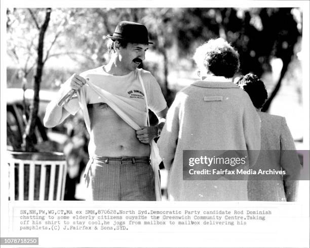 North Sydney Democratic Party candidate Rob Dominish chatting to some elderly citizens outside the Greenwich community centre taking off his shirt to...