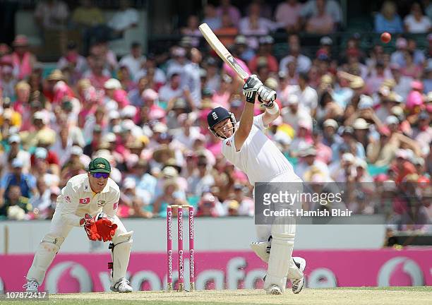Ian Bell of England drives with Brad Haddin of Australia looking on during day three of the Fifth Ashes Test match between Australia and England at...