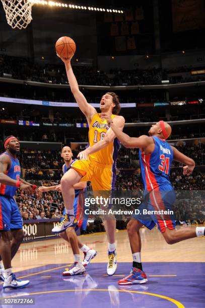 Pau Gasol of the Los Angeles Lakers goes up for a shot against Charlie Villanueva of the Detroit Pistons at Staples Center on January 4, 2011 in Los...