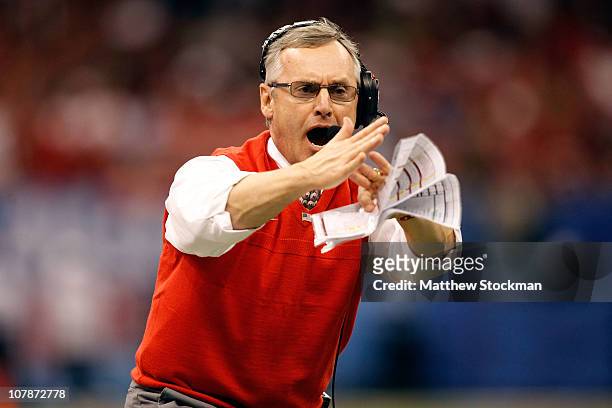 Head coach Jim Tressel of the Ohio State Buckeyes calls a time out in the first half against the Arkansas Razorbacks during the Allstate Sugar Bowl...