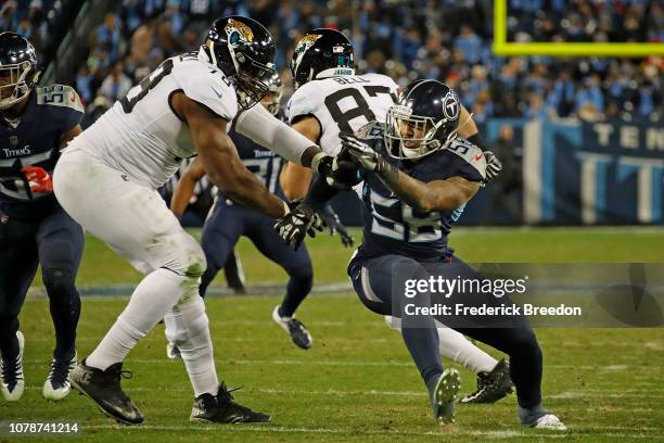 Harold Landry of the Tennessee Titans rushes against Jermey Parnell of the Jacksonville Jaguars at Nissan Stadium on December 6, 2018 in Nashville,...