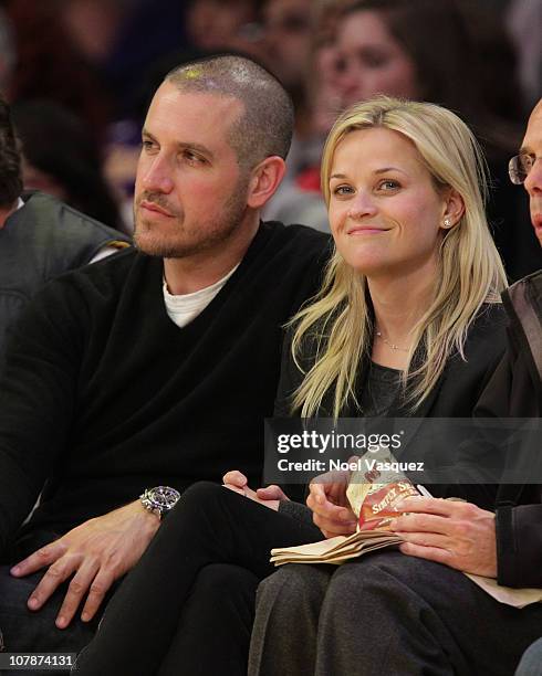 Jim Toth and Reese Witherspoon attend a game between the Detroit Pistons and the Los Angeles Lakers at Staples Center on January 4, 2011 in Los...