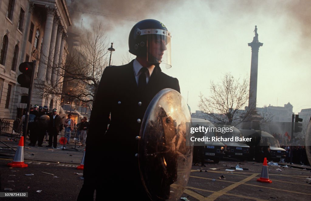 Mancatcher Riot Police Riot police officers stand firm in Trafalgar Square at the height of ...