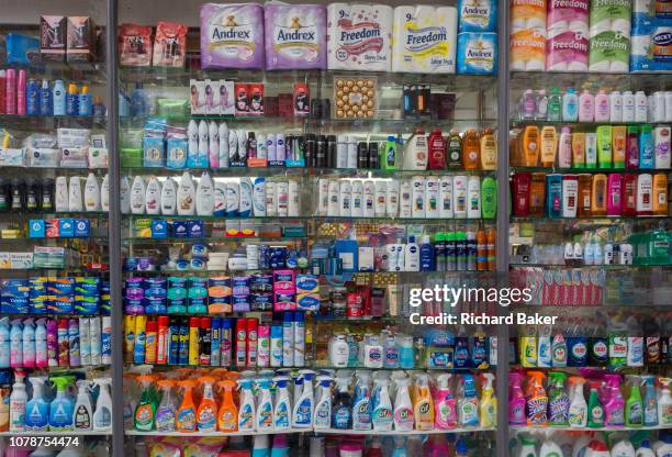 Local supermarket window display showing the retail products being sold in a Kensington convenience store, on 30th December 2018, in London England.