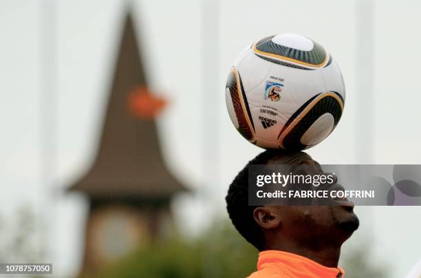 This photo taken on May 19, 2010 shows Ivory Coast team player Emmanuel Eboue playing with the ball during a practice session in Montreux,...