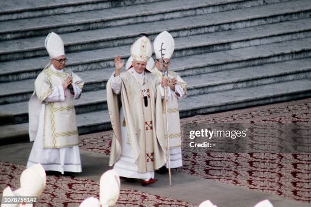 Pope John Paul II salutes the audience during his coronation ceremony in front of the Saint Peter Basilica in Vatican City on October 22, 1978....