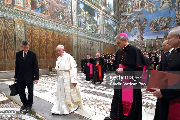 Pope Francis leaves after he poses with the accredited ambassadors to the Holy See at the Sistine Chapel 'Cappella Sistina' on January 7, 2019 in...