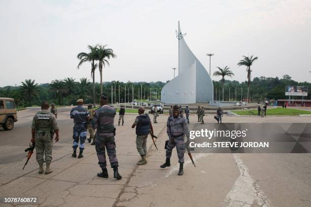 Gabonese gendarmes patrol on the Democracy square in Libreville on January 7, 2018 after a group of soldiers sought to take power in Gabon while the...